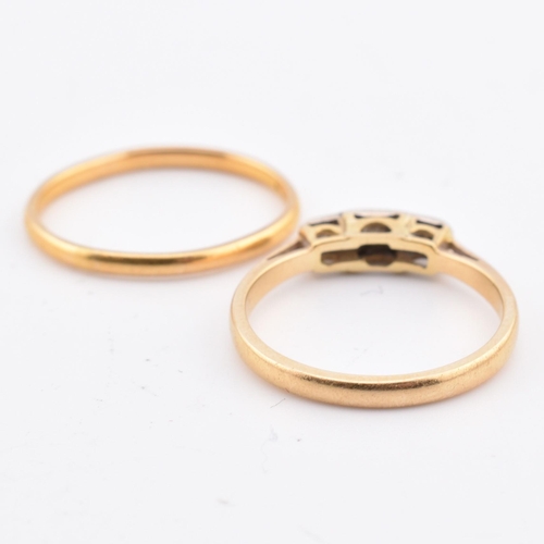 141 - A hallmarked 22ct gold band ring and an 18ct gold and diamond ring. The lot to include a hallmarked ... 