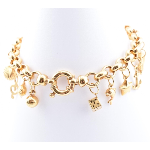 144 - A hallmarked 9ct gold charm bracelet. The 9ct yellow gold charm bracelet comprised of belcher link c... 