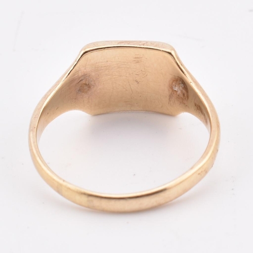 150 - A hallmarked 9ct gold signet ring. The yellow gold signet ring having a squared head with inscribed ... 