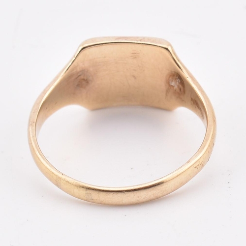 150 - A hallmarked 9ct gold signet ring. The yellow gold signet ring having a squared head with inscribed ... 