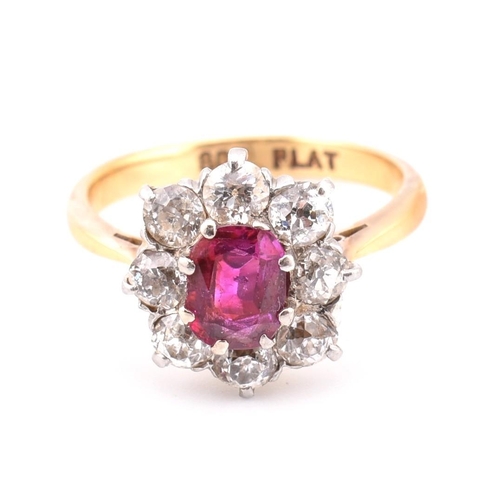 18 - An early 20th century 18ct gold and platinum diamond and ruby cluster ring. The 18ct yellow ring hav... 