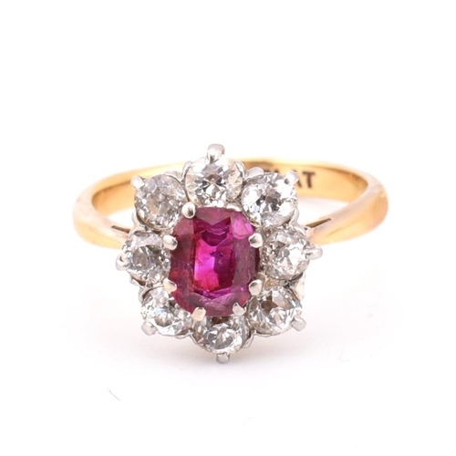 18 - An early 20th century 18ct gold and platinum diamond and ruby cluster ring. The 18ct yellow ring hav... 