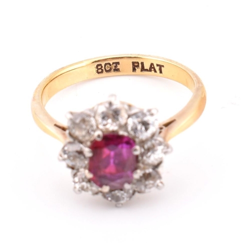 18 - An early 20th century 18ct gold and platinum diamond and ruby cluster ring. The 18ct yellow ring hav... 