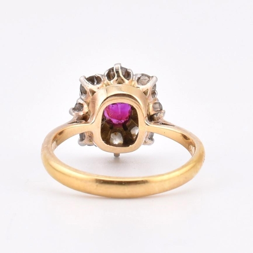 18 - An early 20th century 18ct gold and platinum diamond and ruby cluster ring. The 18ct yellow ring hav... 