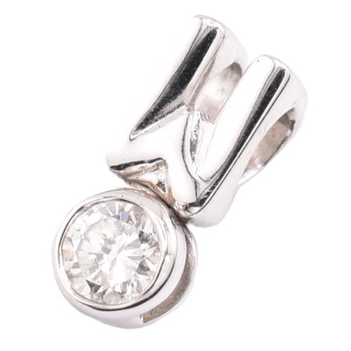 180 - A hallmarked 18ct white gold and diamond necklace pendant. The 18ct white gold pendant set with a si... 