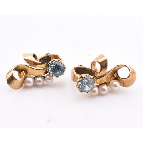 188 - A pair of 9ct gold, zircon and pearl earrings. The 9ct yellow gold clip earrings having a claw set r... 