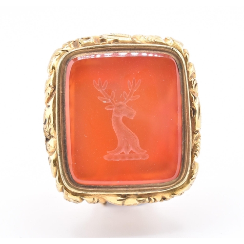 20 - A 19th-century carnelian seal fob with stag intaglio. The antique seal fob having a fox head decorat... 