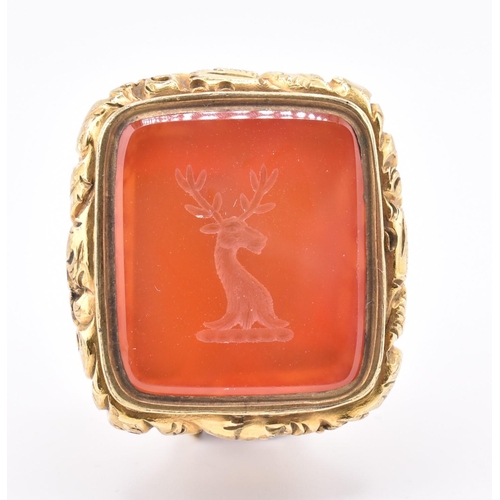 20 - A 19th-century carnelian seal fob with stag intaglio. The antique seal fob having a fox head decorat... 