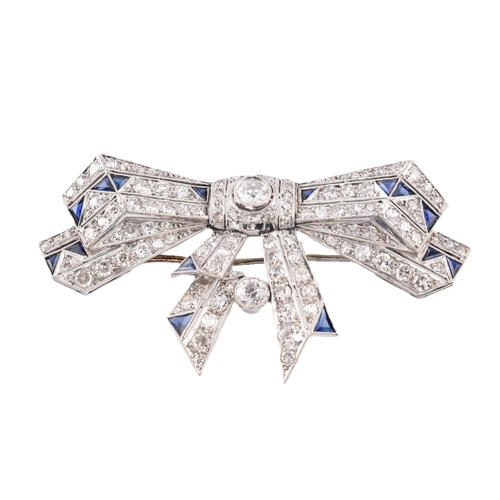 21 - An Art Deco ribbon bow sapphire and diamond brooch pin. The brooch set 104 old and eight cut diamond... 