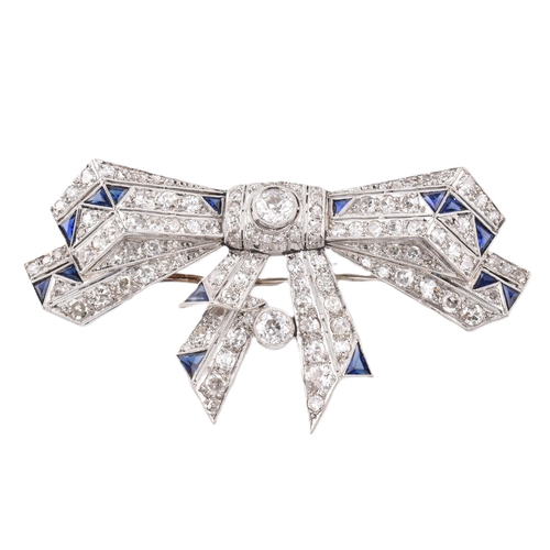 21 - An Art Deco ribbon bow sapphire and diamond brooch pin. The brooch set 104 old and eight cut diamond... 