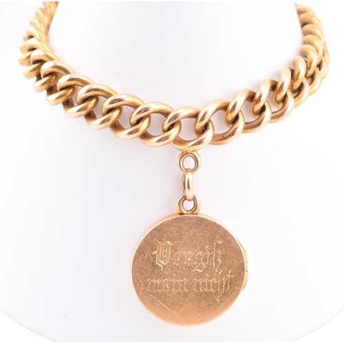 25 - An early 20th-century 18ct gold bracelet and engraved locket. The 18ct yellow gold curb link chain h... 