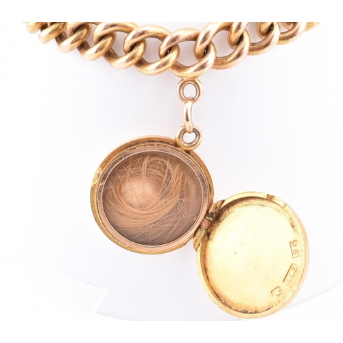 25 - An early 20th-century 18ct gold bracelet and engraved locket. The 18ct yellow gold curb link chain h... 