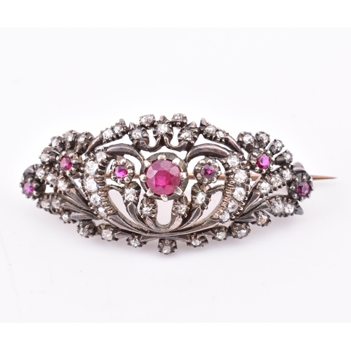 26 - A 19th-century ruby and diamond brooch pin. The 19th century gold-backed silver brooch pin having a ... 