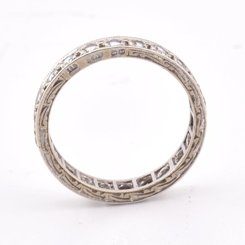 271 - A hallmarked 9ct white gold eternity ring. The 9ct white gold eternity ring set all around with roun... 