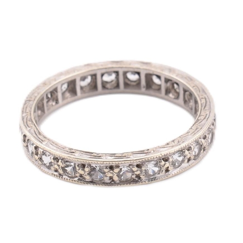 271 - A hallmarked 9ct white gold eternity ring. The 9ct white gold eternity ring set all around with roun... 