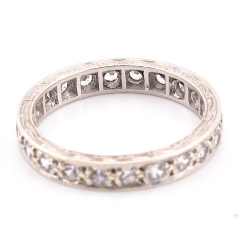 271 - A hallmarked 9ct white gold eternity ring. The 9ct white gold eternity ring set all around with roun... 