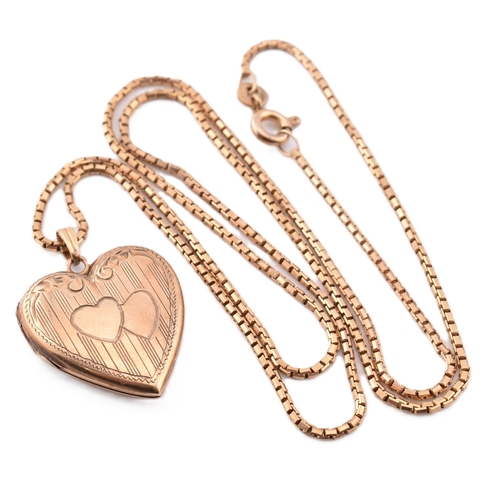 279 - A 10ct gold heart locket pendant on an 18ct gold chain necklace. The 10ct gold heart locket pendant ... 