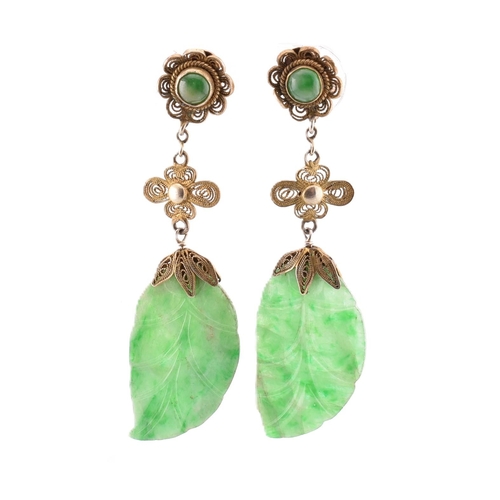 280 - A pair of silver and jade pendant earrings. The earrings having a jade pendant in the form of a leaf... 