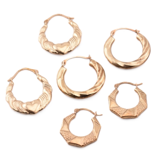 281 - Three pairs of 9ct gold hoop earrings.The lot to include a pair of 9ct gold hoop earrings with heart... 