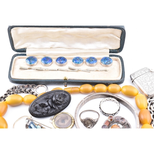 284 - Assorted jewellery and accessories. The lot to include but not limited to, a carved jet brooch pin, ... 