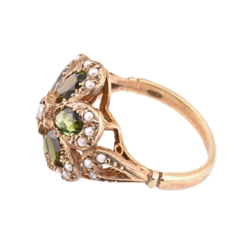 288 - A hallmarked 9ct gold green stone and seed pearl cluster ring. The 9ct yellow gold ring set with a c... 