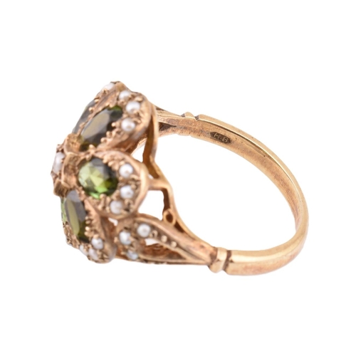 288 - A hallmarked 9ct gold green stone and seed pearl cluster ring. The 9ct yellow gold ring set with a c... 