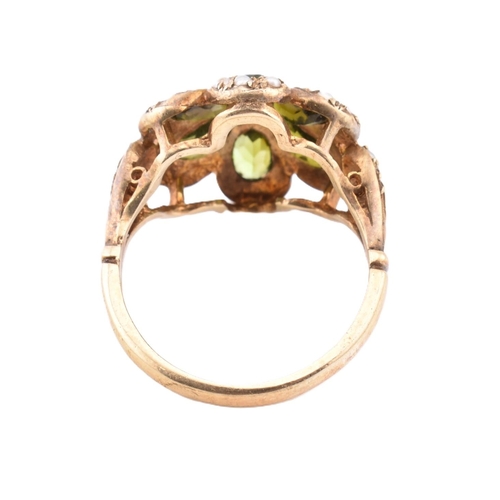 288 - A hallmarked 9ct gold green stone and seed pearl cluster ring. The 9ct yellow gold ring set with a c... 