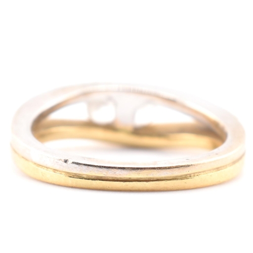 316 - An 18ct bi-colour gold & CZ two stone ring. The 18ct gold bi-colour ring having two channel set ... 