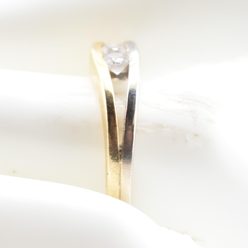 316 - An 18ct bi-colour gold & CZ two stone ring. The 18ct gold bi-colour ring having two channel set ... 