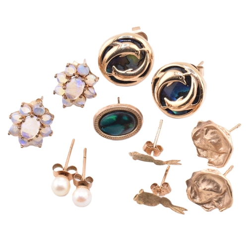 320 - A quantity of 9ct gold and gem set earrings to include abalone, opal, and pearl. The lot sold as fou... 