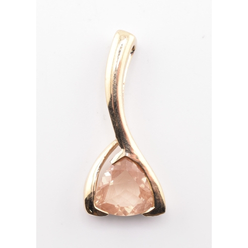 322 - A hallmarked 9ct and Tibetan sunstone necklace pendant. The 9ct yellow gold necklace pendant set wit... 