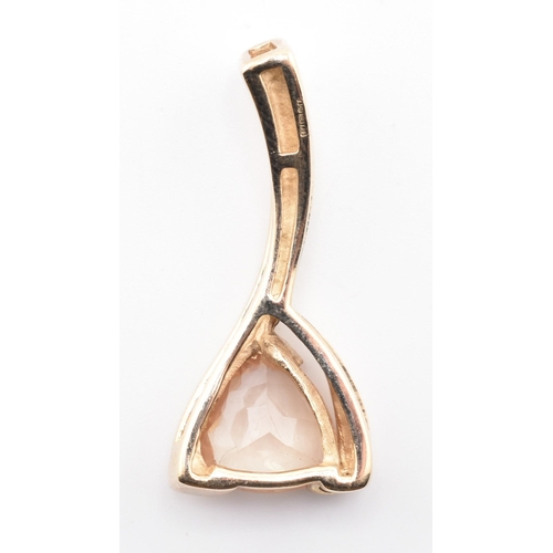 322 - A hallmarked 9ct and Tibetan sunstone necklace pendant. The 9ct yellow gold necklace pendant set wit... 