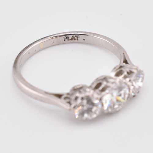 326 - A platinum and diamond three-stone ring. The trilogy ring having three claw set round brilliant cut ... 