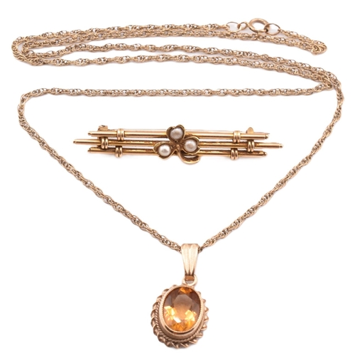 327 - An antique 15ct gold brooch pin and a hallmarked 9ct gold and citrine pendant necklace. The lot to i... 