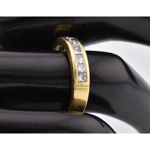 33 - A hallmarked 'hand made' 18ct gold diamond half eternity ring. The ring mounted with 7 channel set p... 