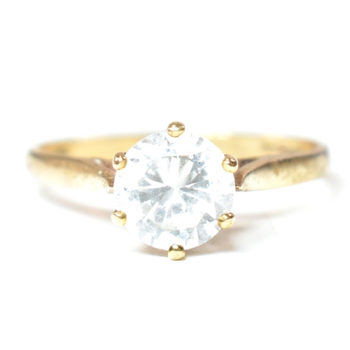 332 - A hallmarked 9ct gold and CZ solitaire ring. The 9ct yellow gold set with a single round cut CZ to p... 