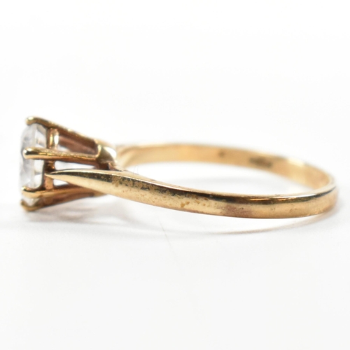 332 - A hallmarked 9ct gold and CZ solitaire ring. The 9ct yellow gold set with a single round cut CZ to p... 