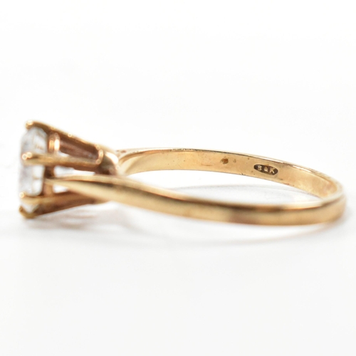 332 - A hallmarked 9ct gold and CZ solitaire ring. The 9ct yellow gold set with a single round cut CZ to p... 