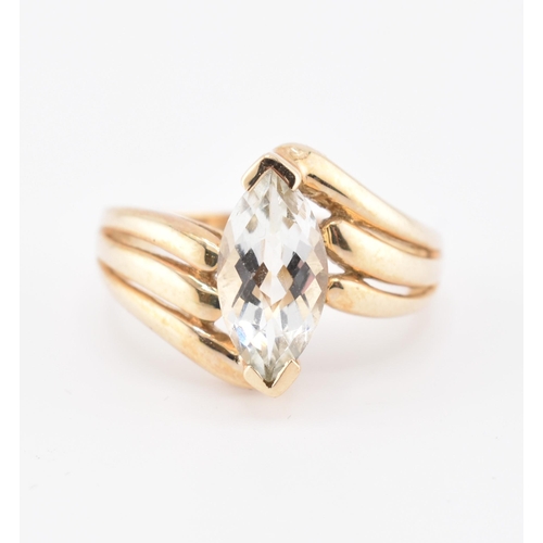 334 - A hallmarked 9ct gold and green amethyst crossover ring. The 9ct yellow gold ring set with a single ... 