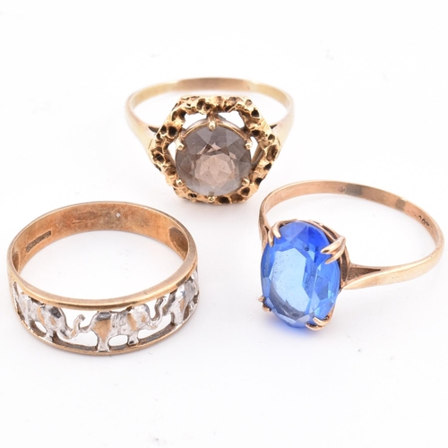 335 - Three 9ct gold rings. The rings to include an elephant band ring, a 9ct gold smoky quartz ring and a... 