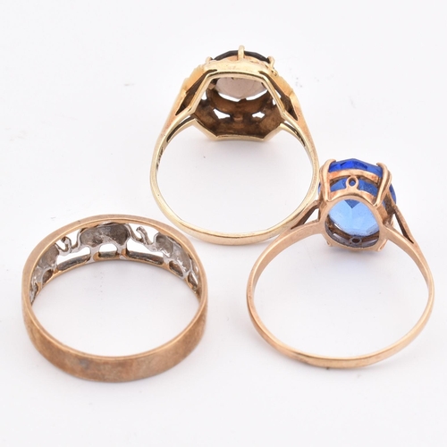 335 - Three 9ct gold rings. The rings to include an elephant band ring, a 9ct gold smoky quartz ring and a... 