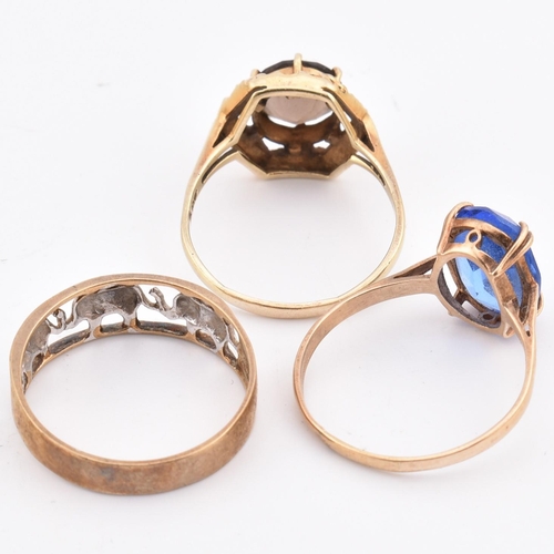 335 - Three 9ct gold rings. The rings to include an elephant band ring, a 9ct gold smoky quartz ring and a... 