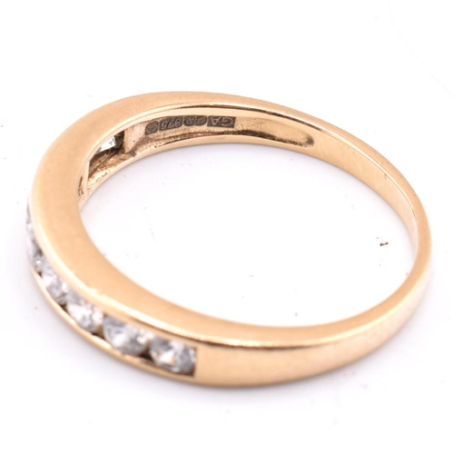 340 - A hallmarked 9ct gold and CZ ring together with a pair of 9ct gold hoop earrings. The lot to include... 