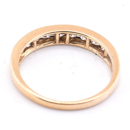 340 - A hallmarked 9ct gold and CZ ring together with a pair of 9ct gold hoop earrings. The lot to include... 