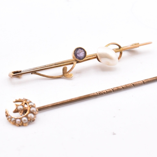 344 - A hallmarked 9ct gold and gem set brooch pin and a gold and seed pearl stick pin. The lot to include... 