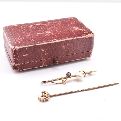 344 - A hallmarked 9ct gold and gem set brooch pin and a gold and seed pearl stick pin. The lot to include... 