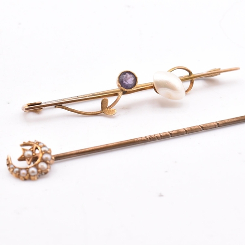 344 - A hallmarked 9ct gold and gem set brooch pin and a gold and seed pearl stick pin. The lot to include... 