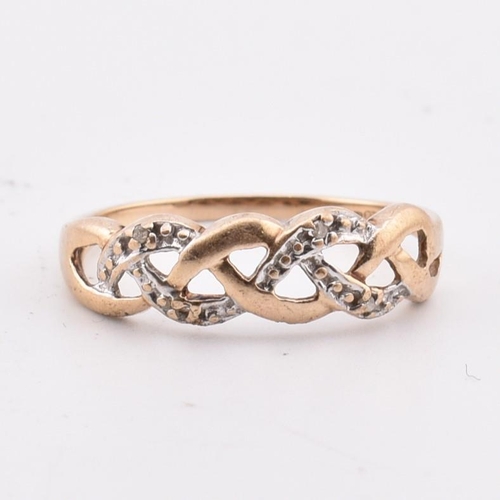 346 - A hallmarked 9ct gold and diamond ring AF. The 9ct yellow gold ring having a pierced, weaved design ... 