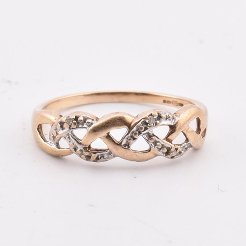 346 - A hallmarked 9ct gold and diamond ring AF. The 9ct yellow gold ring having a pierced, weaved design ... 