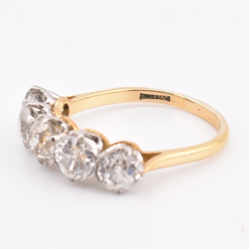 35 - An early 20th century18ct gold and platinum five stone diamond ring. The ring set with five double c... 